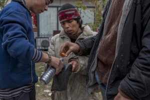 People prepare aurolac drug near Gara de Nord in Bucharest, Romania on November 6, 2011. Aurolac is a toxic glu who caused hallucinations and alleviates the feeling of hunger and cold. During the winter hundreds of persons, sleep in the basement of the city to find heat. 