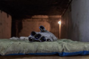 A glove is leaning on an old mattress in a sewer of Gara de Nord in Bucharest, Romania on November 6, 2011. During the winter hundreds of persons, sleep in the basement of the city to find heat. 