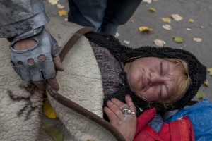 A woman with a gangrenous finger sleeps on a bench near Gara de Nord in Bucharest, Romania on November 6, 2011. During the winter hundreds of persons, sleep in the basement of the city to find heat. 