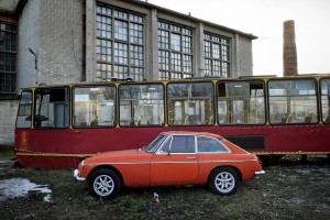 An old bus and a vintage car near the neighborhood “Prague” in Warsaw on February 17, 2014. “Prague”, for some decades working-class neighborhood was abandoned after the Second World War and with the reputation of the danger zone, has now become the heart of the artistic and cultural life of the city.