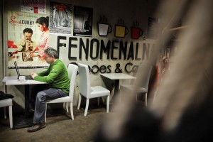 A man at the computer inside the coffee “Fenomenalna” of of Warsaw University on February 13, 2014.