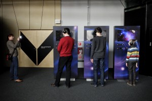 People struggling with interactive experiments at the “Centrum Nauki Kopernik” in Warsaw on February 14, 2014. The building dedicated to Copernicus is located in the center of the capital and features interactive exhibitions, a planetarium and a conference center.