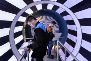 Two boys play with interactive experiments at the “Centrum Nauki Kopernik” in Warsaw on February 14, 2014. The building dedicated to Copernicus is located in the center of the capital and features interactive exhibitions, a planetarium and a conference center.