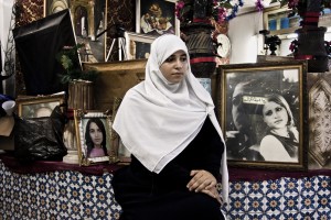 Sirine (18 years) portrayed in the photo studio where he works as a secretary in Tunis on October 12, 2012.