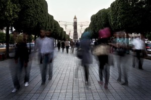 A group of people walking on Avenue Bourguiba, the road that was the scene of the Revolution of 2010-2011 in Tunis on October 17, 2012.