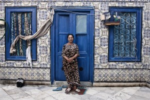 The portrait of a  woman in front of  the entrance of his house in the medina of Halfaouine in Tunis on October 10, 2012.