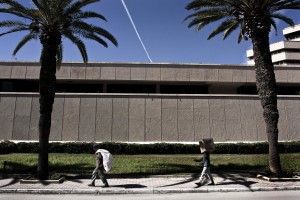 Two workers carrying goods along Avenue Mohamed V in Tunis on October 18, 2012.