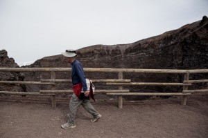 A tourist on the pedestrian path of Vesuvius cone in Naples, Italy on September 9, 2013.   