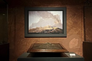 A plastic and a printing of Vesuvius volcano during the exhibition “Fire and Passion” at Museum of San Gennaro treasure Naples, Italy on January 18, 2014.