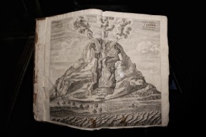 An old book with a picture of Vesuvius volcano during the exhibition “Fire and Passion” at Museum of San Gennaro treasure in Naples, Italy on January 18, 2014.