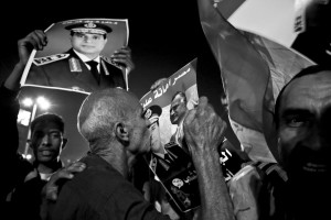 July 19, 2013 – Cairo, Egypt: Anti-Morsi demonstrators show photos of general el-Sisi at Tahrir Square.