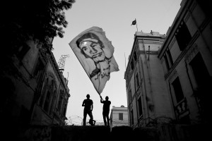 July 17, 2013 – Cairo, Egypt: Anti-Morsi protesters wave a flag representing a friend of them dead during the Egyptian revolution of 2011.