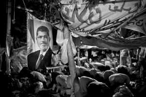 July 12, 2013 – Cairo, Egypt: Supporters of former President Mohammed Morsi pray in Raba square. 