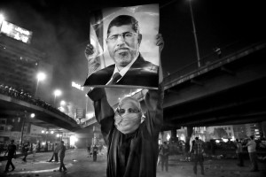 July 15, 2013 – Cairo, Egypt: A supporter of the Muslim Brotherhood and of Egypt’s ousted President Mohamed Morsi during a demonstration under the Six October Bridge in the center of Cairo. The demonstrators demanding the reinstatement of Morsi clashed with riot police as they tried to block the bridge, one of the main highways in the capital. 