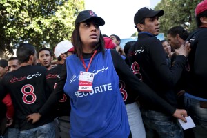 Staff of Tunisian presidential candidate and leader of the Free Patriotic Union (UPL) party, Slim Riahi, at work during the campaign rally held in Avenue Bourguiba in Tunis on November 21, 2014. The Free Patriotic Union came third in last month’s parliamentary election with 16 seats. 