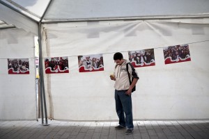 A supporter of Leader of the Popular Front, spokesman of the Tunisian Workers’ Party and presidential candidate Hamma Hammami stands in Avenue Bourguiba in Tunis on November 15, 2014.