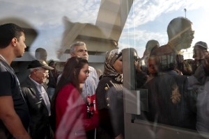 People access into the sports palace in the Olympic city of El Menzah before a campaign meeting of  Beji Caid Essebsi, Tunisian leader of the main anti-Islamist party Nidaa Tounes and presidential candidate in Tunis on November 15, 2014. 