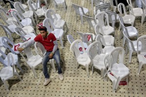 A boy rests inside the sports palace in the Olympic city of El Menzah after the campaign meeting of  Beji Caid Essebsi, Tunisian leader of the main anti-Islamist party Nidaa Tounes and presidential candidate in Tunis on November 15, 2014. 
