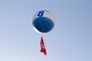 A big ballon supporting the Tunisian presidential candidate and leader of the Free Patriotic Union (UPL) party, Slim Riahi, flys in the sky during a campaign rally in the capital of Tunis on November 21, 2014. The Free Patriotic Union came third in last month’s parliamentary election with 16 seats. 