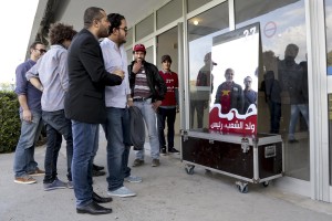 Supporters of the leader of Popular Front, spokesman of the Tunisian Workers’ Party and presidential candidate Hamma Hammami before a meeting held at Sports palace in the Olympic city of El Menzah in Tunis on November 16, 2014.