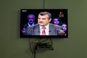 A television shows the presidential candidate Mohamed Hachemi Hamdi during a political TV program in Tunis on November 19, 2014.