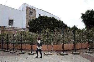 A woman walks near the tunisian Ministry of finance in Tunis on November 13, 2014.