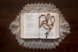 A bible and a crown on the table of Marina house in Rufoli on February 27, 2015. Marina Rinaldi is the first ex trans in the world to coach a soccer team.