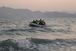 A group of Pakistani migrants arrive on the beach in a dinghy at dawn after making their way from Turkey in Kos island, Greece on June 14, 2015. Many migrants are continuing to arrive on the Greek Island of Kos from Turkey. The Island has recently seen a drop in tourist numbers which has been attributed to negative reports on the migrant crisis that is continuing to grip the area. Around 30,000 migrants have entered Greece so far in 2015, with the country calling for more help from its European Union counterparts.