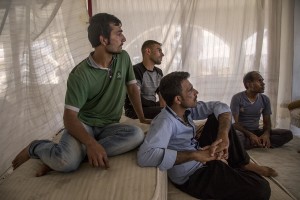 Migrants from Pakistan are seen inside an abandoned hotel where many migrants sleep in Kos island, Greece on June 10, 2015. Many migrants are continuing to arrive on the Greek Island of Kos from Turkey. The Island has recently seen a drop in tourist numbers which has been attributed to negative reports on the migrant crisis that is continuing to grip the area. Around 30,000 migrants have entered Greece so far in 2015, with the country calling for more help from its European Union counterparts.