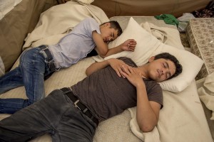 Pakistani migrants rest in a tent near an abandoned hotel where many migrants sleep in Kos island, Greece on June 8, 2015. Many migrants are continuing to arrive on the Greek Island of Kos from Turkey. The Island has recently seen a drop in tourist numbers which has been attributed to negative reports on the migrant crisis that is continuing to grip the area. Around 30,000 migrants have entered Greece so far in 2015, with the country calling for more help from its European Union counterparts.