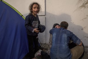 A little girl cries with her family during clashes with Hungarian anti-riot police at the Serbian border with Hungary in Horgos, Serbia on September 16, 2015. Hungary’s border with Serbia has become a major crossing point into the European Union, with more than 160,000 access Hungary so far this year.