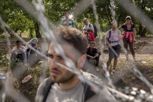 Migrants are seen near the Serbian border with Hungary in Rozske, Hungary on September 15, 2015. The right-wing nationalist government led by Viktor Orbán has closed the entire border with Serbia on September 15, 2015 after the entry into force of new rules that make it illegal and punishable by law. Hungary’s border with Serbia has become a major crossing point into the European Union, with more than 160,000 access Hungary so far this year.