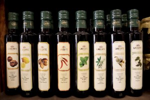 August 11, 2015 – Gallipoli, Italy: Oil Bottles for sale in a shop of typical products of Puglia.  