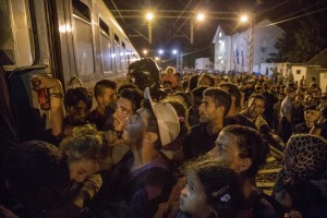 Migrants in Tovarnik train station getting on the train to continue their journey in the north of Europe despite moves by Slovenia and Hungary to hold them back in Tovarnik, Croatia on September 19, 2015. From September 15, 2015 about 8,900 refugees entered Croatia and the authorities announced that they will have to restore border controls if the flow will remain buoyant.