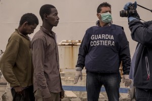 Refugees are seen after the arrival of the Coast Guard ship “Bruno Gregoretti” at Naples harbour on October 23, 2016. The 466 refugees on the ship were mostly from Nigeria, Eritrea, Gambia, Pakistan and Bangladesh.