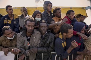 Migrants expect to receive a meal after the arrive of the tanker “Chimera” with 545 immigrants in Salerno port on April 21, 2015. More than 500 migrants were rescued from the waters of the Mediterranean Sea in the last days.