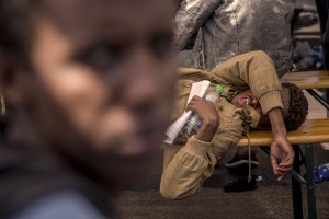 A migrant destroyed by fatigue after the arrive of the tanker “Chimera” with 545 immigrants in Salerno port on April 21, 2015. More than 500 migrants were rescued from the waters of the Mediterranean Sea in the last days.