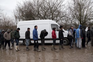 January 30, 2016 – Grande-Synthe, France: Migrants line up waiting for food offered by some charities inside the refugee camp of Grande-Synthe near Dunkirk, northern France, known as “The Jungle 2.” Around 3,000 refugees and migrants of Kurdish descent from Iraq and Syria live in the camp.