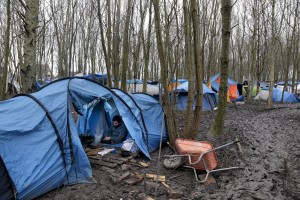 January 29, 2016 – Grande-Synthe, France: A migrant is seen in his tent inside the refugee camp of Grande-Synthe near Dunkirk, northern France, known as “The Jungle 2″. Around 3,000 refugees and migrants of Kurdish descent from Iraq and Syria live in the camp.