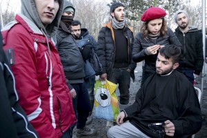 January 30, 2016 – Grande-Synthe, France: A volunteer cuts migrants hair inside the refugee camp of Grande-Synthe near Dunkirk, northern France, known as “The Jungle 2″. Around 3,000 refugees and migrants of Kurdish descent from Iraq and Syria live in the camp.