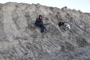 January 28, 2016 – Calais, France: A migrant is seen outside the refugee camp of Calais, known as ‘The Jungle.’ While migrants have for years sought to cross over to Britain from Calais, the numbers have shot up since the refugee crisis went into overdrive last year.