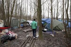 January 29, 2016 – Grande-Synthe, France: A migrant walks inside the refugee camp of Grande-Synthe near Dunkirk, northern France, known as “The Jungle 2.” Around 3,000 refugees and migrants of Kurdish descent from Iraq and Syria live in the camp.