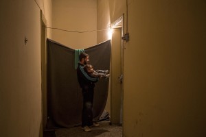 A Syrian man with his daughter in a corridor of the railway station near the Idomeni refugee camp on the Greek Macedonia border in Idomeni, Greece on March 17, 2016.