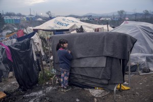 A girl is seen inside the refugee camp along the border of Greece and Macedonia near the town of Idomeni, in Greece on March 17, 2016. The refugees are being stopped from moving beyond Greece and have been languishing in the rain, mud, and cold with insufficient food and medical care while sleeping in small tents.