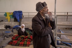 A man and a woman from Iraq are seen in a railway livestock shed where they are camping inside the Idomeni refugee camp on the Greek Macedonia border in Idomeni, Greece on March 20, 2016.