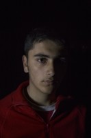 Mohamed, 17 years old from Aleppo, Syria is portrayed in the makeshift camp at the Greek-Macedonian borders near the village of Idomeni in Greece, on March 18, 2016.