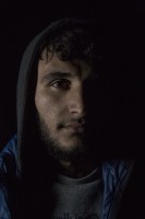 Aram, 18 years old from Kobani, Syria is portrayed in the makeshift camp at the Greek-Macedonian borders near the village of Idomeni, in Greece on March 20, 2016.