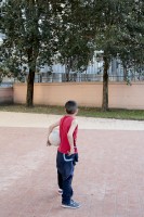 April 14, 2016 – Naples, Italy: A child is seen outside the Arci Scampia soccer school in Scampia district. The Football School is a non-profit company born in 1986 that since its establishment has always been sensitive to social problems of Scampia neighbourhood, acting as a reference point to protect children at risk.