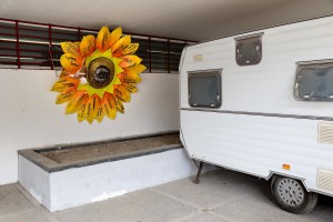 February 24, 2016 – Naples, Italy: A paper sunflower close to the entry of “Officina delle Culture”. On each of the sunflower petal is marked the name of one of the green areas recovered by the association “Volontari per Napoli” in Scampia district. “Officina delle culture” is a multi-purpose center born in the Neapolitan neighborhood of Scampia and dedicated to Gelsomina Verde, an innocent victim of Camorra. The site is run by the association “Resistenza Anticamorra” and its objective is to offer concrete alternatives to children at risk but also to prisoners who have no restrictive measures.