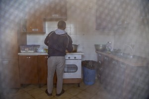 LAGO PATRIA, ITALY – APRIL 23: A migrant prepares a meal inside the kitchen of “Crescere Insieme”, a CAS (Extraordinary Reception Center) in Campania, Southern Italy on April 23, 2017. CAS are imagined in order to compensate the lack of places inside ordinary reception center in case of substantial arrivals of migrants.